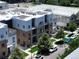 Aerial view of modern townhomes equipped with solar panels and shared outdoor spaces at 2530 Lawrence St # Ra301, Denver, CO 80205
