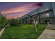 Exterior of the building includes well-kept lawn, swings and walking paths, providing a beautiful communal space at 2530 Lawrence St # Ra301, Denver, CO 80205