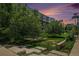 Landscaped exterior featuring green spaces, mature trees, walking paths and modern-style architecture at 2530 Lawrence St # Ra301, Denver, CO 80205