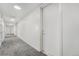 Bright hallway showcasing neutral walls, carpet, recessed lighting, and unit number 301 at 2530 Lawrence St # Ra301, Denver, CO 80205