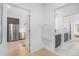Open hallway view to kitchen and bathroom with built-in counter at 2530 Lawrence St # Ra301, Denver, CO 80205