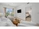 Living room showcasing a modern design with balcony access and view to the main bedroom at 2530 Lawrence St # Ra301, Denver, CO 80205