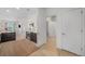 Open-concept living area with hardwood floors, modern kitchen, and doorway to bathroom at 2530 Lawrence St # Ra301, Denver, CO 80205