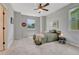 Bedroom with modern ceiling fan and great natural light at 581 Stonemont Dr, Castle Pines, CO 80108