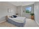 Neutral bedroom filled with natural light from the large window at 581 Stonemont Dr, Castle Pines, CO 80108