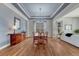 Dining room showcasing coffered ceilings, hardwood floors, and elegant lighting at 581 Stonemont Dr, Castle Pines, CO 80108