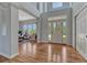 Spacious foyer with hardwood floors and natural light flooding the room at 581 Stonemont Dr, Castle Pines, CO 80108