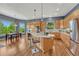 Spacious kitchen featuring a center island, stainless steel appliances, and bright breakfast nook at 581 Stonemont Dr, Castle Pines, CO 80108