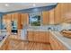 Updated kitchen with stainless appliances, ample storage, and easy access to dining area at 581 Stonemont Dr, Castle Pines, CO 80108