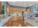 Bright kitchen with stainless steel refrigerator, plenty of cabinetry, and modern countertops at 581 Stonemont Dr, Castle Pines, CO 80108