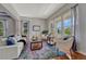 Bright living room with large windows and elegant furnishings at 581 Stonemont Dr, Castle Pines, CO 80108