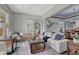 Comfortable living room with stylish decor and a view to the staircase at 581 Stonemont Dr, Castle Pines, CO 80108