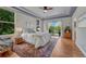 Spacious main bedroom with tray ceiling, natural light, and balcony access at 581 Stonemont Dr, Castle Pines, CO 80108