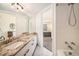 Bathroom featuring marble counter, vanity, and view of bedroom at 2 Acoma St # 11, Denver, CO 80223