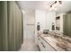 Bathroom with vanity, marble countertop, and modern fixtures at 2 Acoma St # 11, Denver, CO 80223