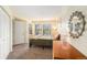 Bright bedroom boasts plush carpet, closet, and natural light from window at 2 Acoma St # 11, Denver, CO 80223