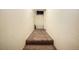 Carpeted hallway and storage racks at 2 Acoma St # 11, Denver, CO 80223