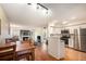 Open living space featuring dining area, living room with fireplace, and modern kitchen at 2 Acoma St # 11, Denver, CO 80223