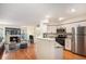 Spacious living area with a modern kitchen, fireplace, and comfortable seating at 2 Acoma St # 11, Denver, CO 80223