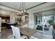 Bright dining room with access to the patio and open to the kitchen at 23451 E Rockinghorse Pkwy, Aurora, CO 80016