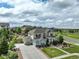 Beautiful home with a large driveway and well-manicured front yard at 23451 E Rockinghorse Pkwy, Aurora, CO 80016