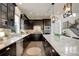 Well-equipped kitchen with stainless steel appliances, tile backsplash, and a functional island at 23451 E Rockinghorse Pkwy, Aurora, CO 80016