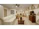 Spacious living room featuring a comfortable sofa, stylish decor, and an entertainment center, creating an inviting atmosphere at 23451 E Rockinghorse Pkwy, Aurora, CO 80016