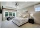 Serene main bedroom with a tray ceiling, large windows, and a luxurious king-size bed at 23451 E Rockinghorse Pkwy, Aurora, CO 80016