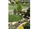 Landscaped backyard with stone edging, vibrant plants, a manicured lawn, and a tranquil view at 11879 W Portland Dr, Littleton, CO 80127