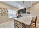 Wet bar with custom cabinetry, quartz countertops, and modern fixtures for a stylish entertainment space at 11879 W Portland Dr, Littleton, CO 80127