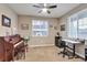 Bright bedroom with a piano, desk, neutral walls, and a ceiling fan at 11879 W Portland Dr, Littleton, CO 80127