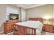 Bedroom with wooden furniture set and bright natural lighting at 11879 W Portland Dr, Littleton, CO 80127