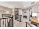 Second floor hallway with a bookshelf, accent table, and view to stairs at 11879 W Portland Dr, Littleton, CO 80127