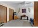 Bedroom featuring two closets, neutral walls and carpet, and ceiling fan at 2213 Emery St # C, Longmont, CO 80501