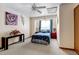 Bedroom featuring two side tables, a ceiling fan and natural light at 2213 Emery St # C, Longmont, CO 80501