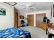 Bedroom featuring two closets, neutral walls and carpet, and ceiling fan at 2213 Emery St # C, Longmont, CO 80501