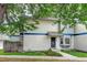 Front exterior view of a well-maintained two-story townhome with a landscaped yard at 2213 Emery St # C, Longmont, CO 80501