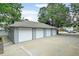 Attached three-car garage with white doors in a well-maintained condition at 2213 Emery St # C, Longmont, CO 80501