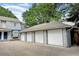 View of the three-car garage in a well-maintained condition with gray exterior at 2213 Emery St # C, Longmont, CO 80501