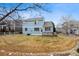 Large backyard with a wood deck and lush landscaping at 9928 Candlewood Ct, Highlands Ranch, CO 80126