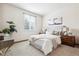 Serene bedroom with a plush bed, soft carpet, and natural light creates a relaxing retreat at 9928 Candlewood Ct, Highlands Ranch, CO 80126