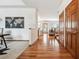 Welcoming hallway featuring hardwood floors, neutral walls, and a clear view into the spacious living areas at 9928 Candlewood Ct, Highlands Ranch, CO 80126