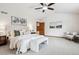 Spacious bedroom with vaulted ceiling, carpet, and neutral decor provides a relaxing atmosphere at 9928 Candlewood Ct, Highlands Ranch, CO 80126