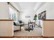 Bright office featuring a tray ceiling, neutral walls, modern furnishings and a large window for natural light at 9928 Candlewood Ct, Highlands Ranch, CO 80126