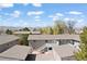 Aerial view of an apartment complex with mountain views and surrounding greenery at 8367 S Reed St # A3, Littleton, CO 80128