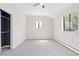Carpeted bedroom with neutral walls, ceiling fan and natural light from window at 8367 S Reed St # A3, Littleton, CO 80128