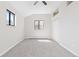 Bright bedroom with large windows and soft carpeting at 8367 S Reed St # A3, Littleton, CO 80128