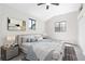 Serene bedroom with vaulted ceilings, two windows, and a plush bed at 8367 S Reed St # A3, Littleton, CO 80128