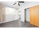 Bedroom with hard surface floors, a ceiling fan, and a closet with light wood doors at 8367 S Reed St # A3, Littleton, CO 80128