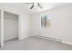Cozy bedroom featuring a window, closet, neutral walls and carpeting at 8367 S Reed St # A3, Littleton, CO 80128
